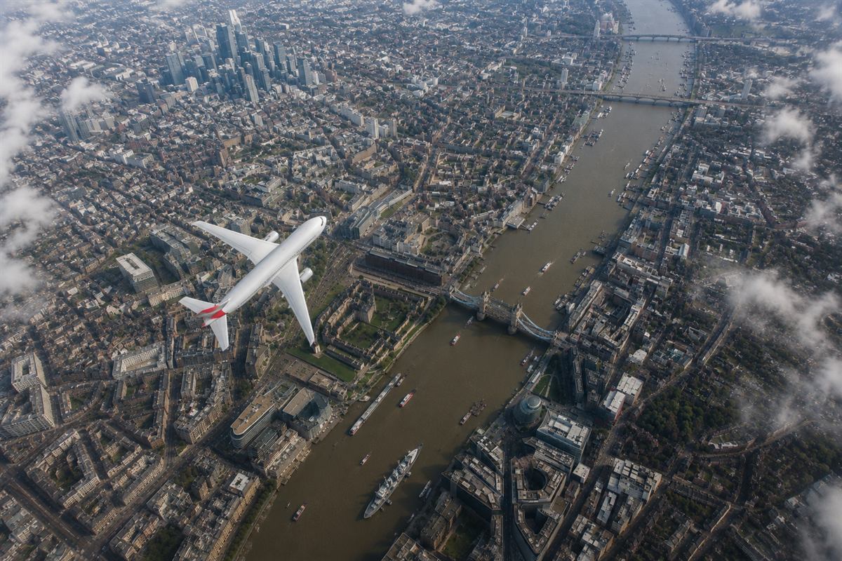 Aerial view of an aircraft flying above the River Thames and Tower Bridge in London